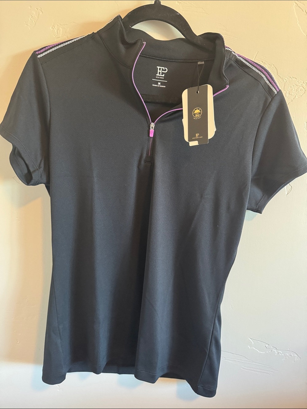 EP New York golf, tennis or Pickleball shirt. Quarter zip top.